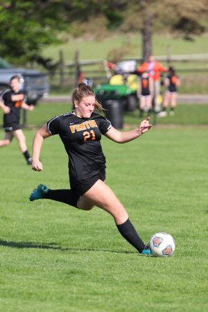 Getting ready to kick the ball down field, freshman Elena Kinsman kicks the ball to a teammate. On May 9, the JV girls played Frankenmuth, lost 0-2. 