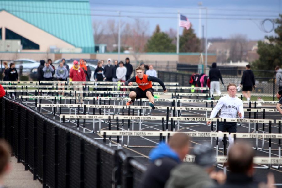 Jumping+over+a+hurdle%2C+junior+Caleb+Markley+races+to+the+finish+line.+On+April+26%2C+the+FHS+track+team+competed+against+the+Linden+Eagles%2C+winning+88-49.+