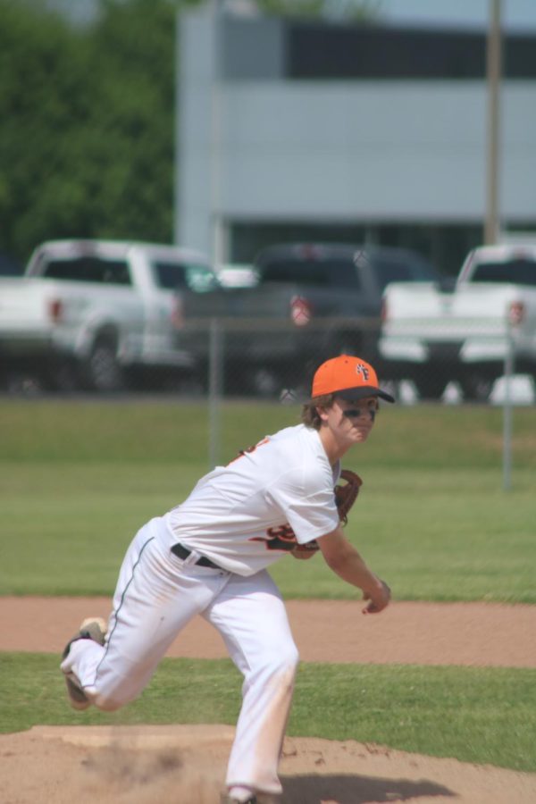 After finishing his pitch, freshman Connor Mcdermott looks at the ball. On May 25, the FHS freshman baseball team played against Bay City and lost 8-7. 