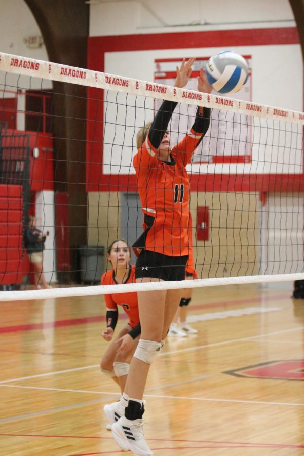 Blocking the ball, sophmore Alexandra Shouse defends an attack from the oppenets. On Sept. 12 the JV volleyball team played the Swartz Creek Dragons; winning all three sets. 