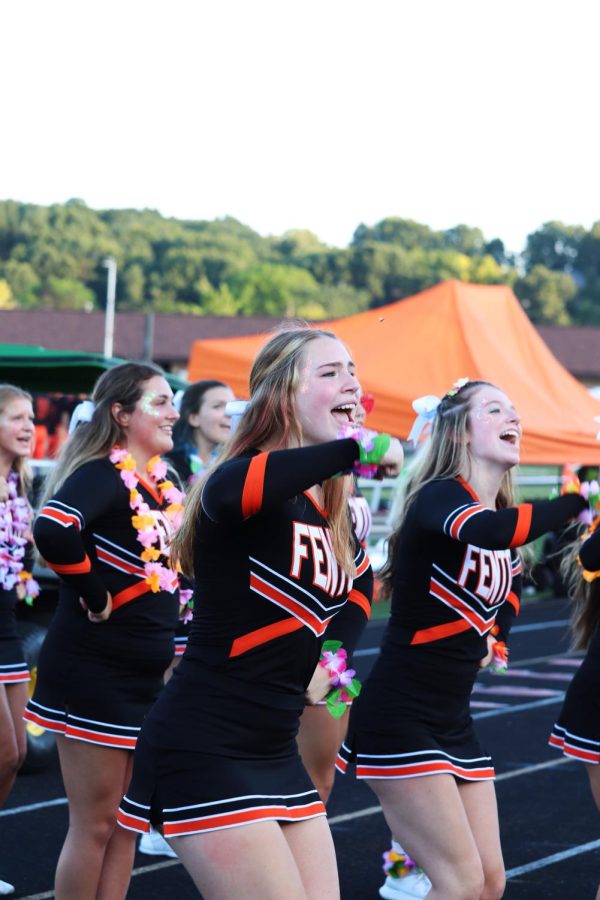 Senior Sophia Wagner cheering at the game against East Lansing on Sept. 1.  The Tiger lost 14-28