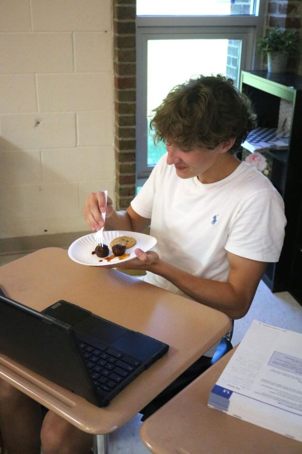 Eating, senior Zachary Whitten enjoys his meatballs. On Sep. 13, the students in Vera Hazletts srt had a party.