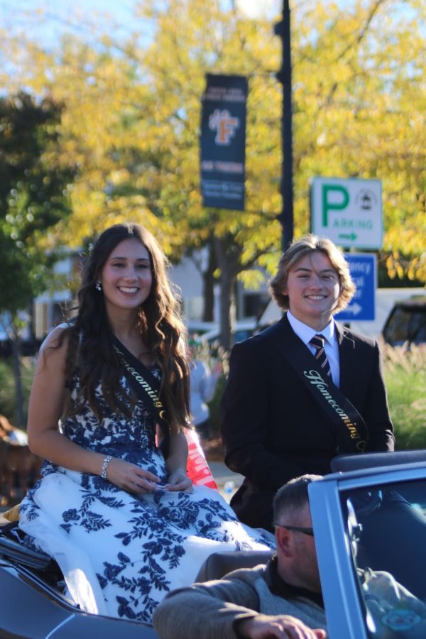 Smiling, Seniors  Adam Barcom and Maddie Burnau represent the Senior class on homecoming court. On Sept. 30 the Fenton comunity held the annual homecoming parade. 