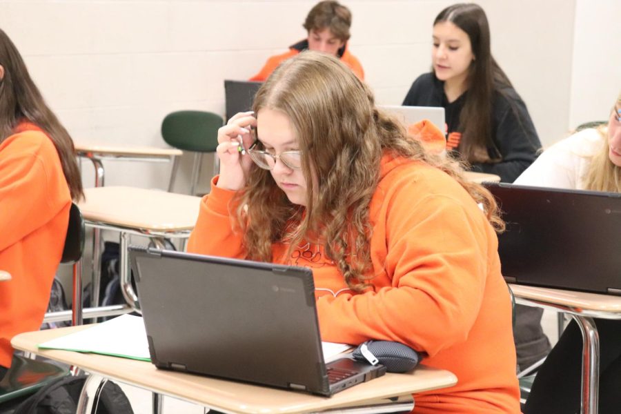 Working on an assignment, sophomore Savannah Purtee participates in spirit day. On Sept. 30, students of FHS participated in orange and black spirit day for homecoming week. 
