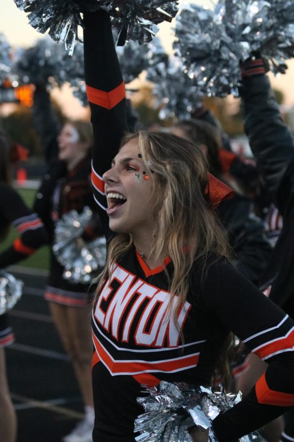 Cheering to the student section, junior Chole Justus on Sept. 30 at the homecoming game. The Tigers played Kearsey and won 43-8. 