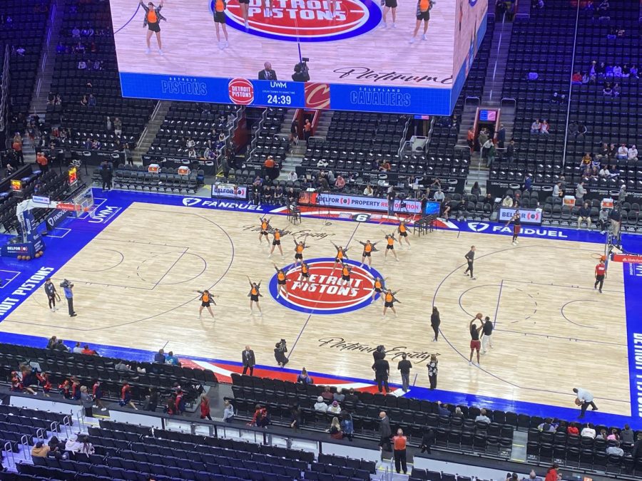 Dancing, the FHS varsity dance team performs at the Little Caesars Arena. On Nov. 27, the team got the opportunity to perform before the Detroit Pistons basketball game.