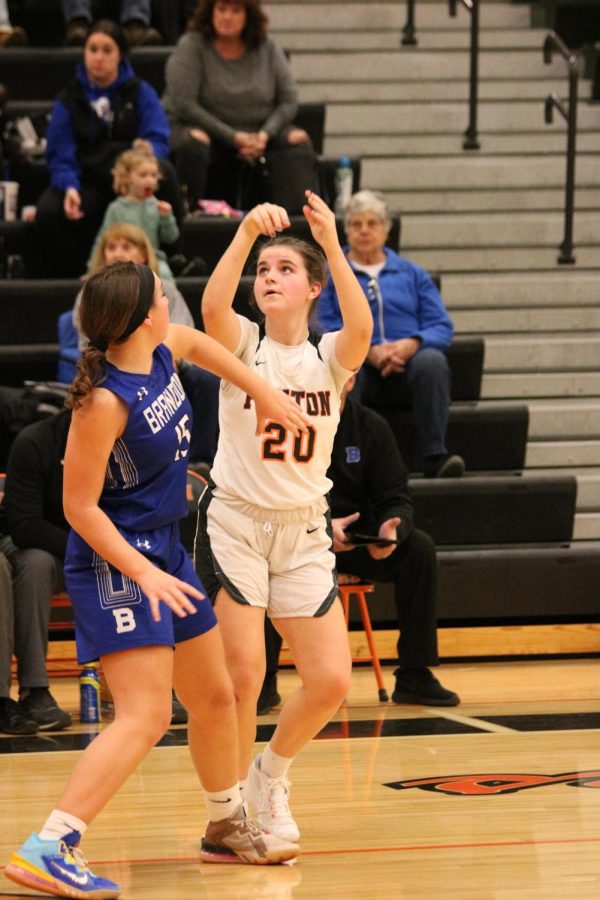 Looking at the basket, senior Abby Logan takes her shot. On Dec. 5, the Fenton girls varsity basketball team went up against Brandon and won 67-41. 