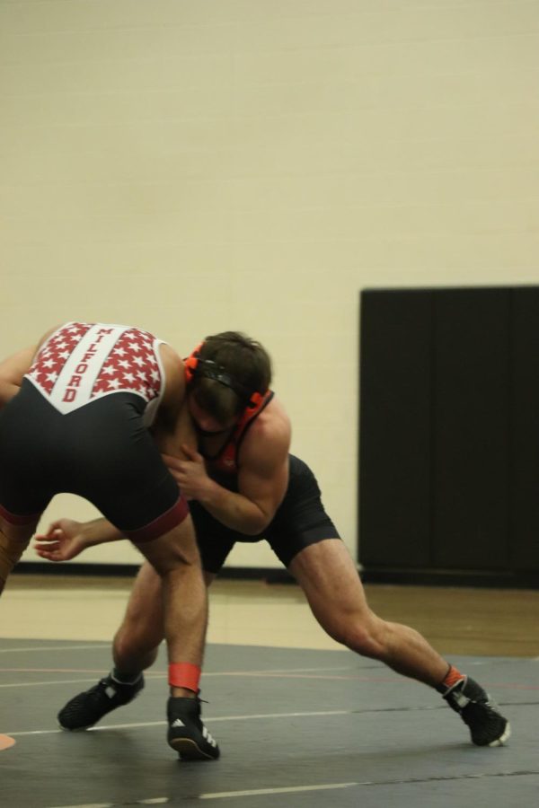 Senior Kyle Dunfield prepares to take his opponent down. On Dec. 3 Fenton versed Milford high in a scrimmage.