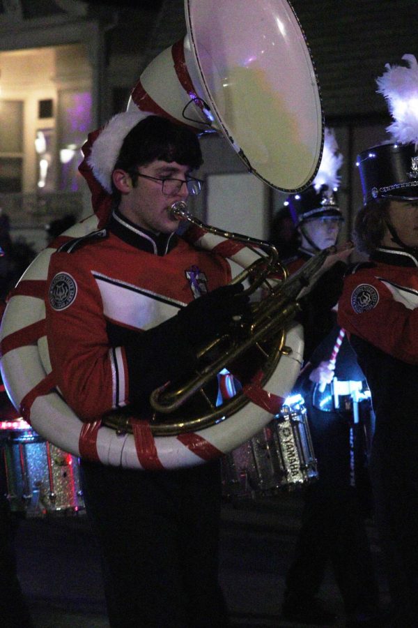 Junior Elijah Thomas plays the tuba. On Dec. 3rd the fenton band marched in the jingle fest parade. 