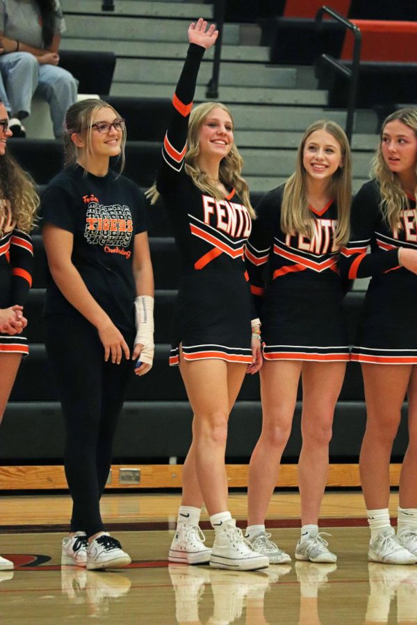 Waving to the crowd, sophomore Lydia Klemish introduces herself. On Nov. 30, FHS hosted Meet the Team to showcase the new incoming winter sports teams. 