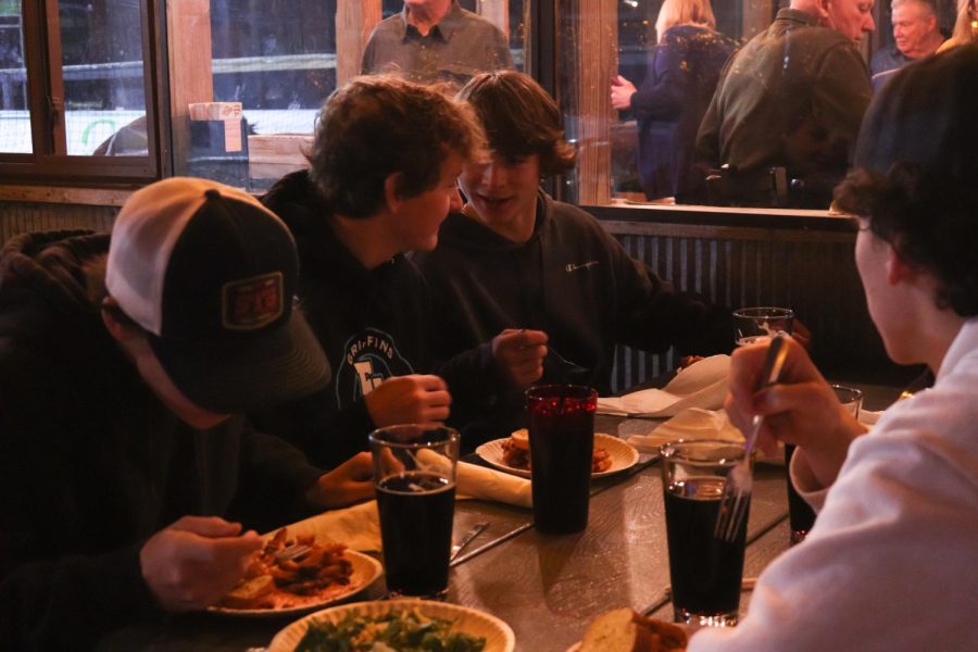 Laughing, senior Jace Dumeah and junior Hank Wojtaszek attend a team dinner at The Barn. On Jan. 12, The Griffins hockey team prepares for their Friday game against the Bay Area Thunder.