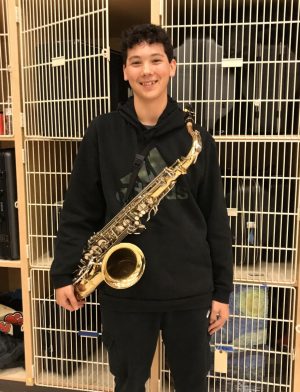 “Something that makes me happy is coming into the band room and playing music. I quickly realized in fifth grade that I really wanted to do band when we played the recorder in music class; the year after that I started playing the saxophone. My favorite memory is when we went to Disney World last year; my favorite part was definitely the workshops when we played different Disney songs.” -sophomore Dom DuPei
