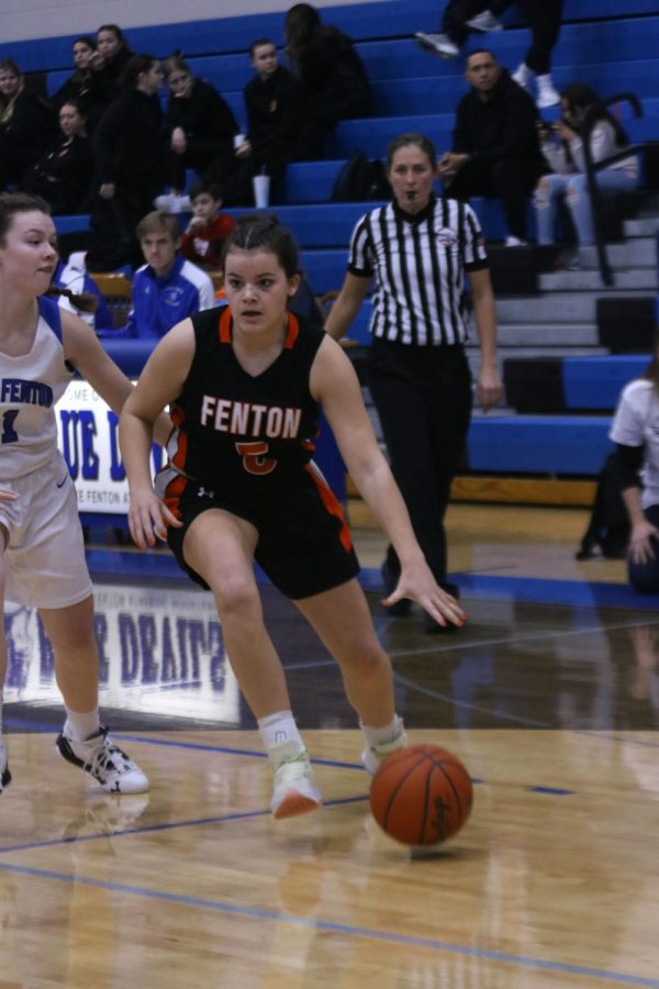 Dribbling, sophomore Anna Logan drives to the hoop. On Jan. 6, the JV girls played Lake Fenton and lost 35-40. 
