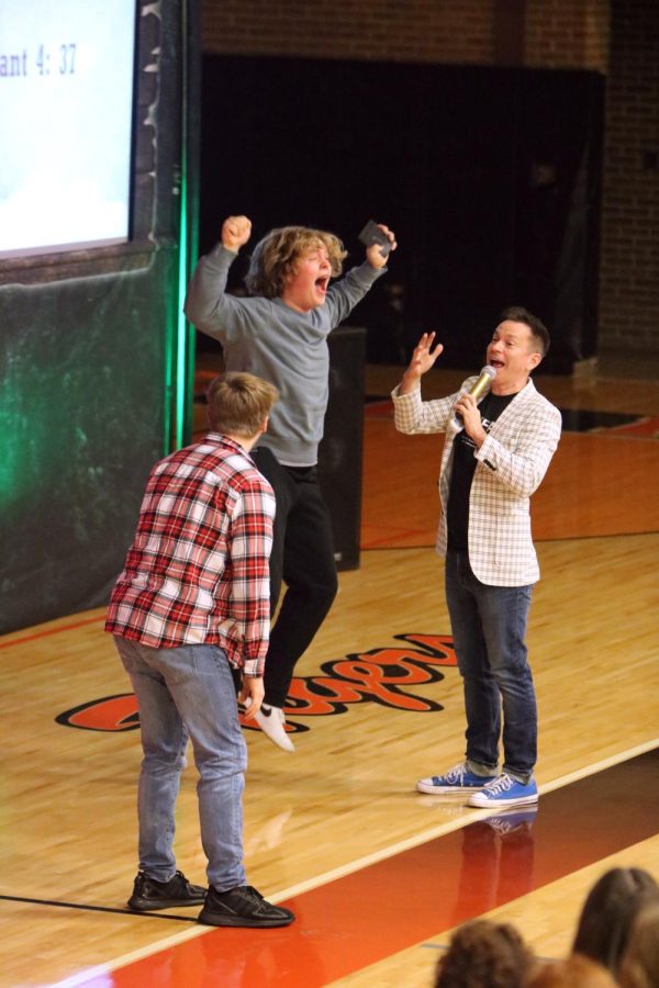 Jumping, junior Vaughn House throws his hands after winning an Amazon gift card. On Jan. 19 FHS hosted a Think Fast driving assembly for the sophomores and juniors. 