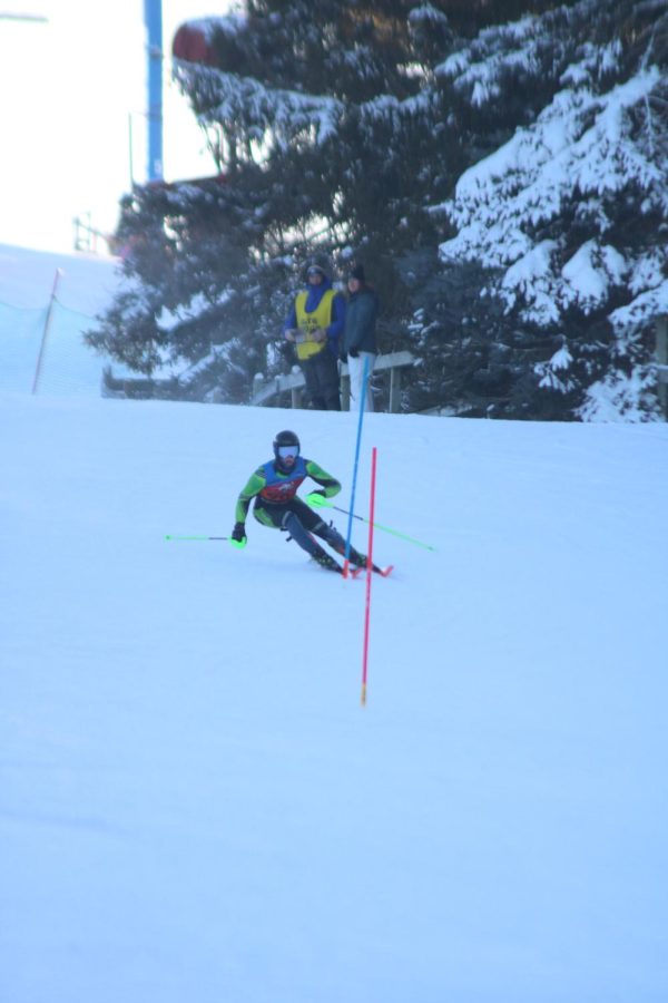 Senior Brooks Funke races his way down the hill at Mt. Holly. On Feb. 1, the Fenton/Linden/Lake Fenton ski team beat Grand Blanc on the slopes with Brooks helping his team in the 3rd position.
