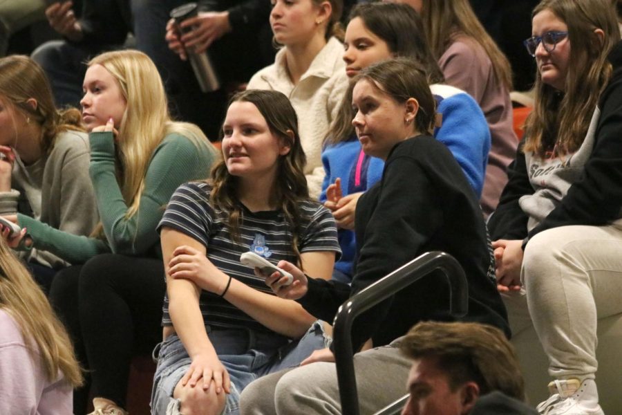 Discussing, junior Ella Brown and Allie Michewicz try to answer a question. On Jan. 19 FHS hosted a Think Fast driving assembly for the sophomores and juniors. 