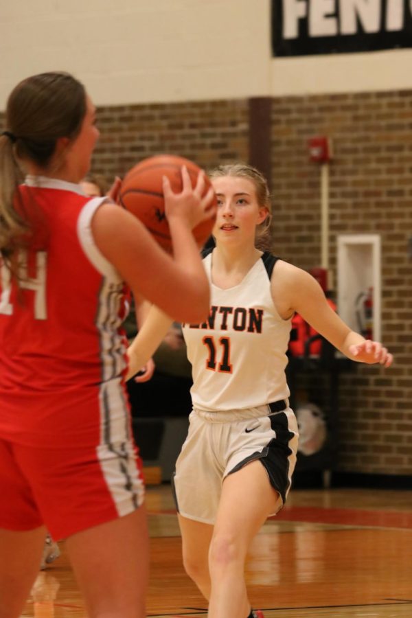 Running up to defend the ball senior Lauren Gadola. On Feb 7 the Fenton girls took on Holly and won 63-43. 