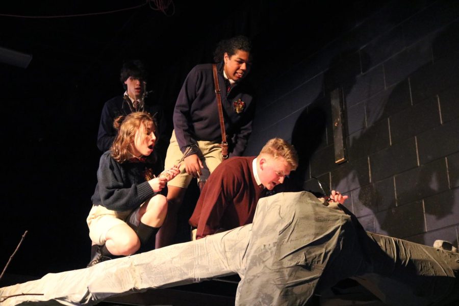Acting, seniors Noah Marsh, Hana Cashmere, Ibrahim Sene, and Brad Pattan pretend to build a fire. On March 9, the FHS IB Theatre students performed the play, Lord of the Flies. 