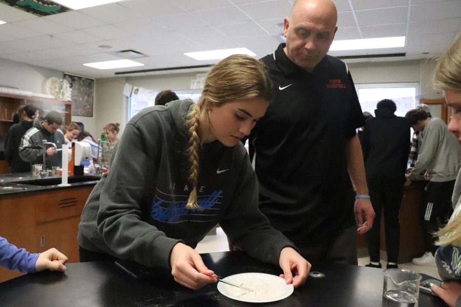Mixing plaster, senior Sienna Sahr works with her group on a lab. On Mar. 8, Science Teacher Matthew Sullivans Forensics class works on a teeth molding lab.  