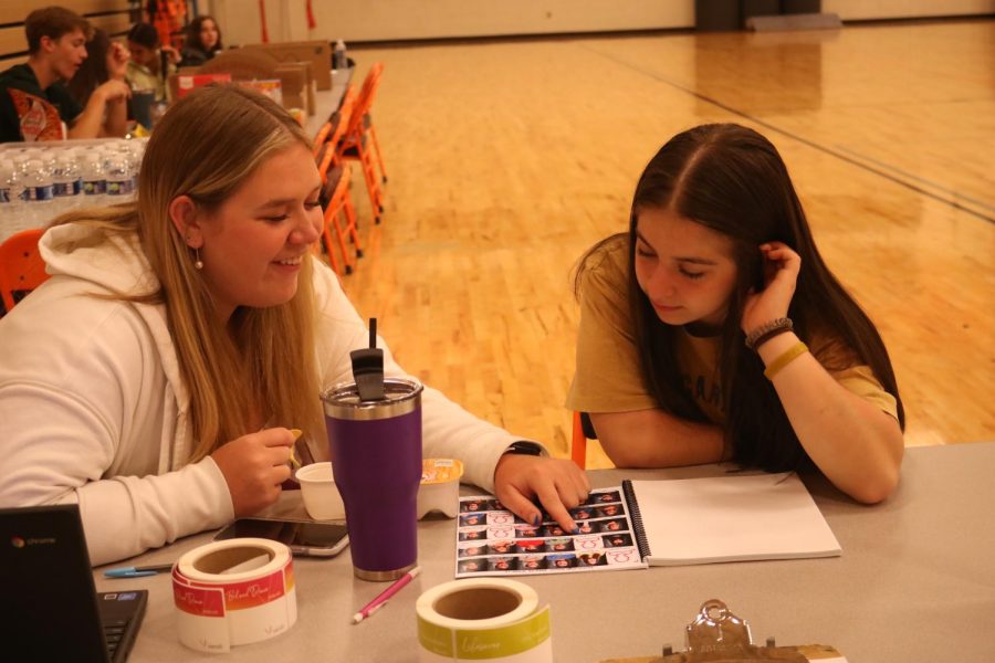 Signing students in, seniors Erin McVey and Veronica Mrazik confirm students identities. On April 21, FHS hosted a blood drive and National Honors Society members volunteered at it. 