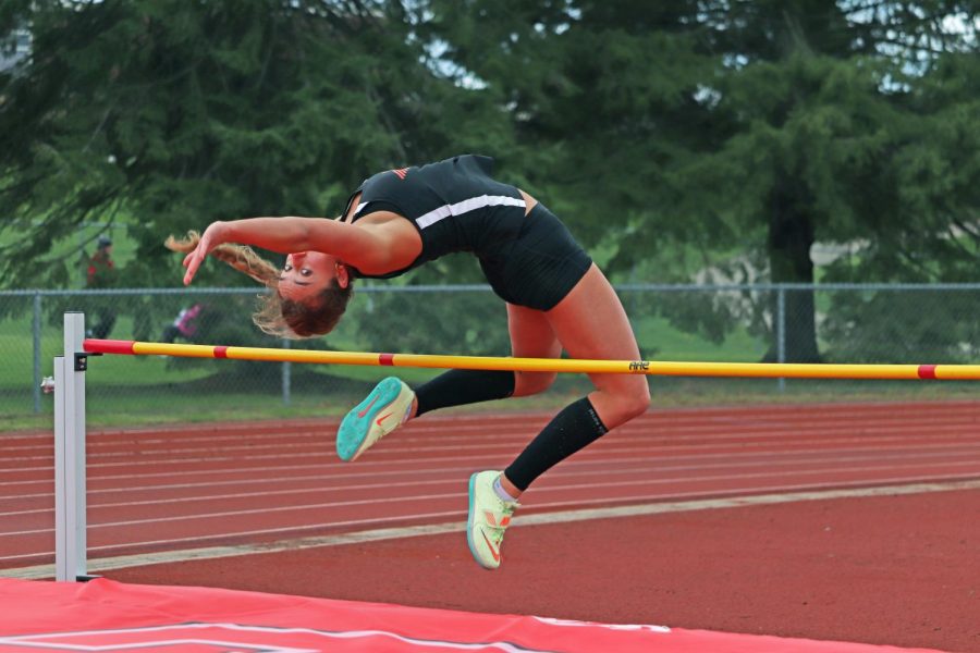 Jumping, junior Victoria Henson participates in high jump. On May 3, the Fenton Varsity Track team travelled to Linden to compete; losing 57-71.