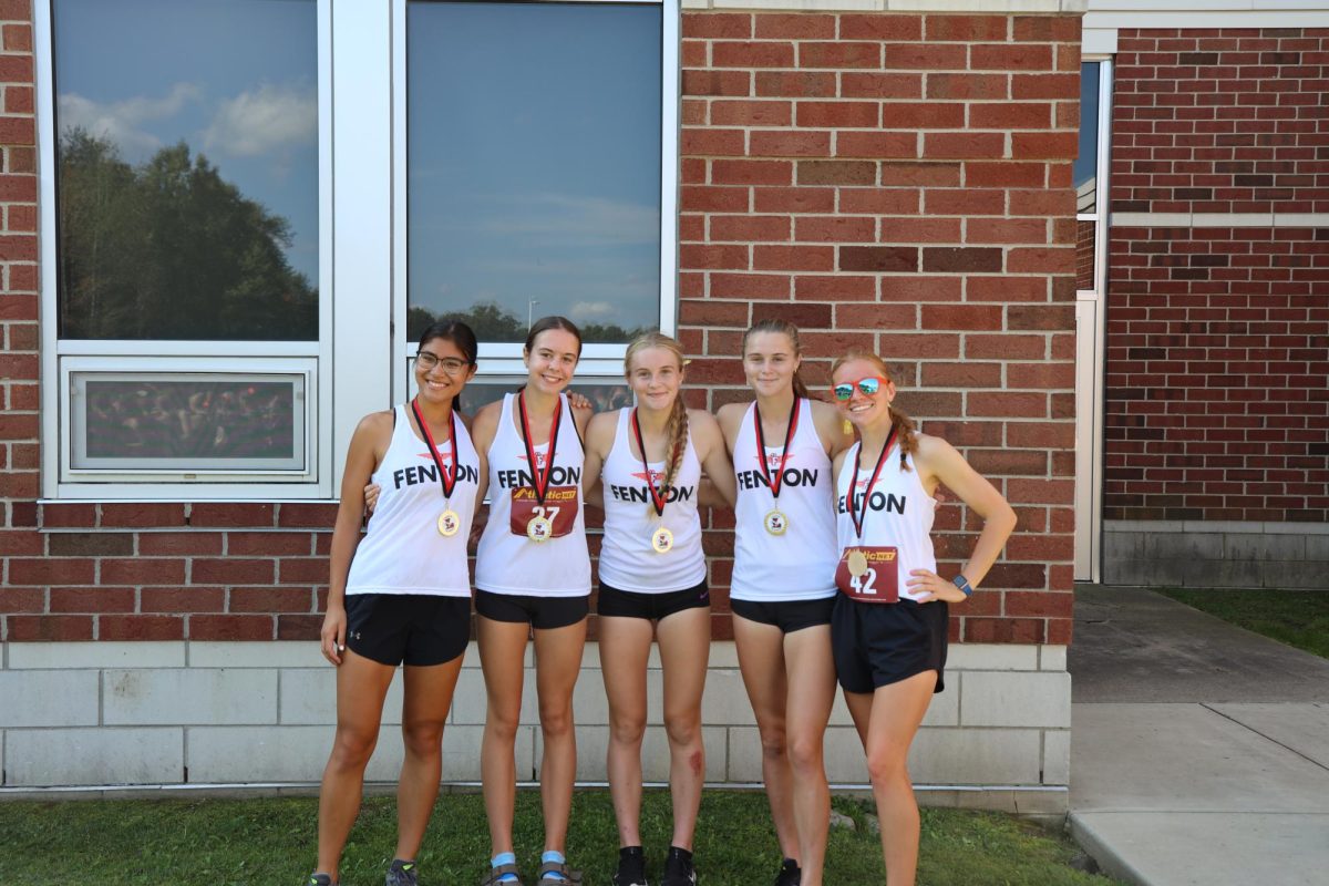 Placing third at the 40th Linden Classic Invitationals, the top 5 Fenton girls pose with their medals. On Sept. 23, Senior Nina Frost placed first with a time of 19:46.