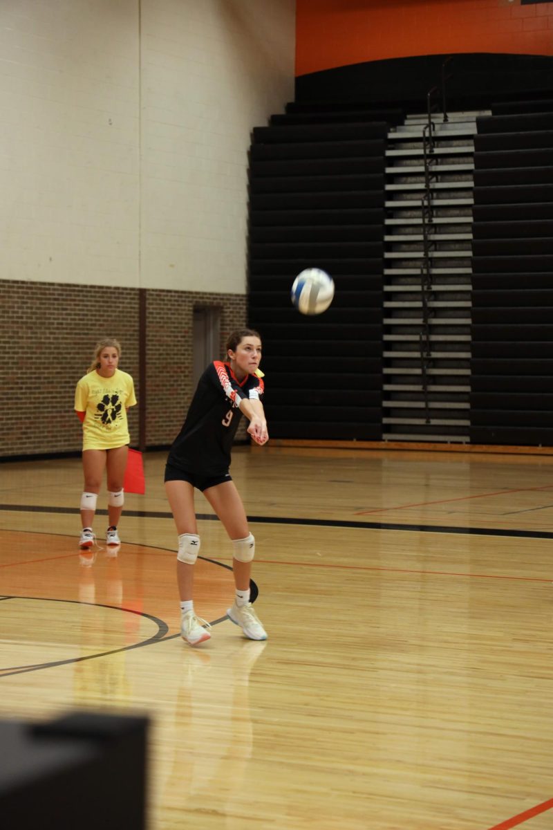 Following through, Sophomore Addison Smith passes the ball to her teammate. On Sept. 13, the Fenton JV volleyball team competed against Kearsley High School and won all 3 sets.