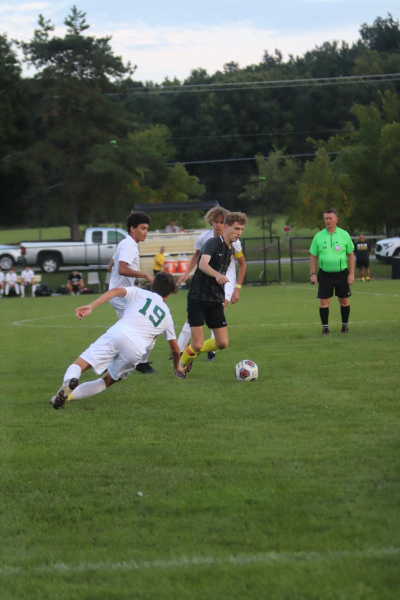 Senior Zac Jones competes over the ball against his opponent. The tigers beat Grove High School 2-1 on Sept. 21.