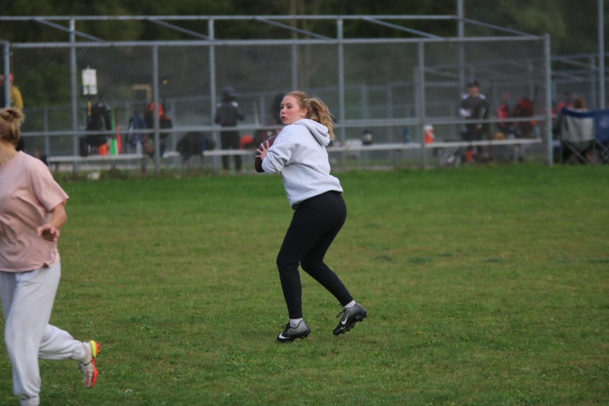 Getting ready to throw, junior Kaylee Kaluza looks for her open receiver. On Sept. 26 juniors had Powder Puff practice to get ready to face the seniors on Oct. 2nd.