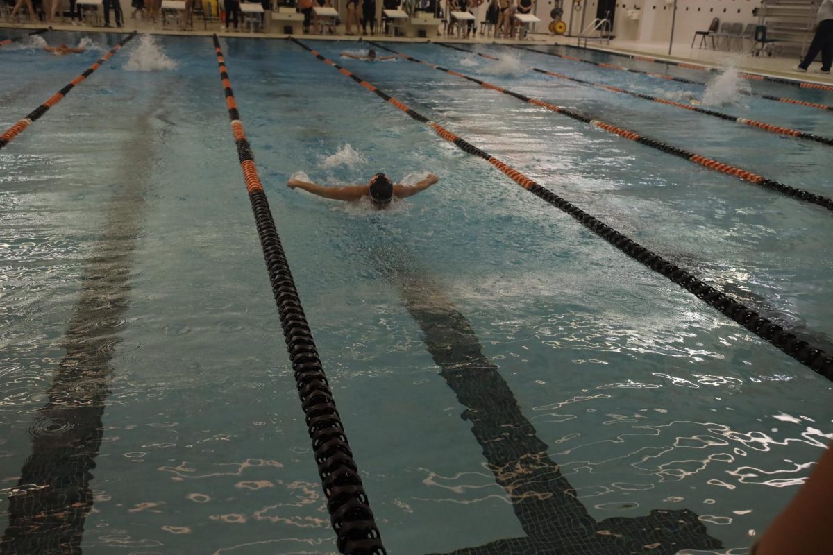 Swimming freestyle, junior Tess Heavner completes the 100 free. On Oct. 05, Heavner raced in the Tri Meet. 