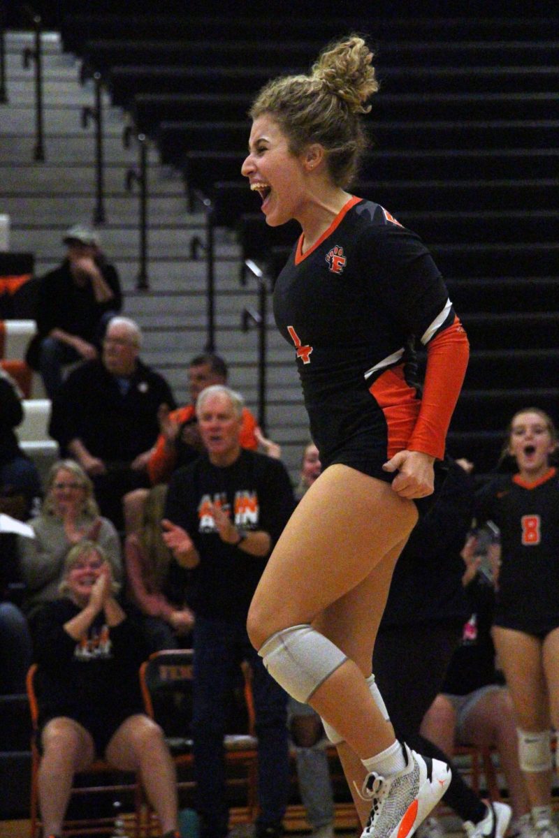 Screaming, senior Olivia Shampo celebrates earning a point. On Oct. 16, the Varsity Volleyball team competed against Linden winning 3-1. 