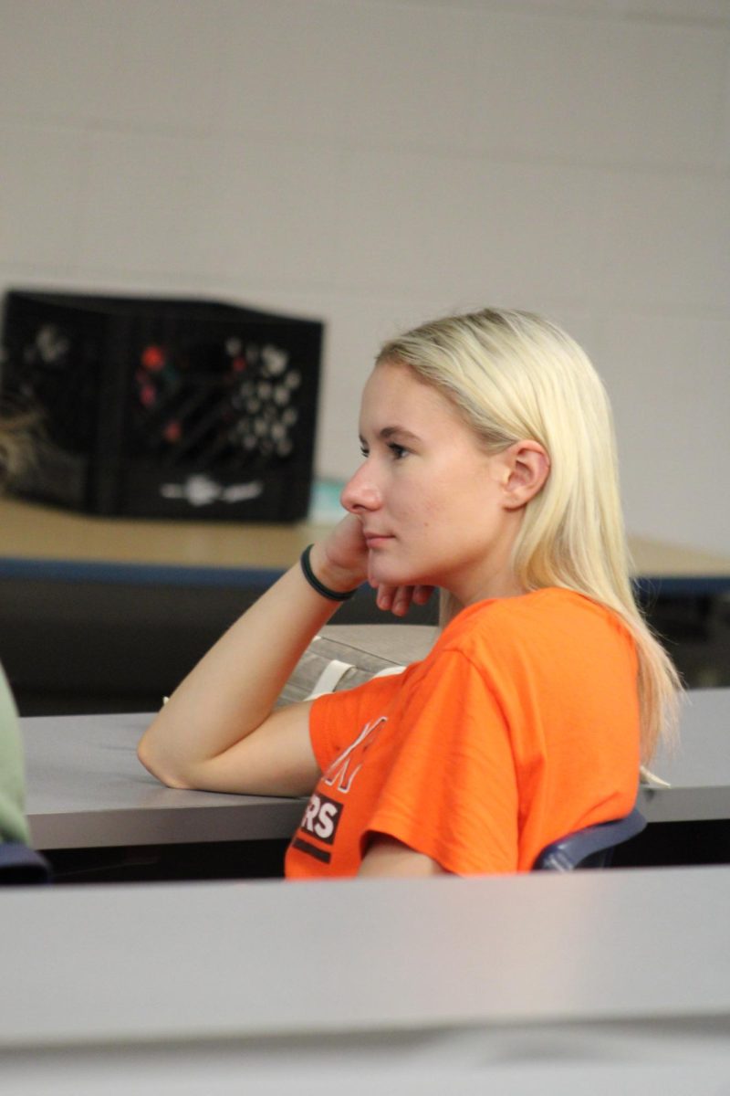 Senior, Aj D'Epifanio sitting in the lecture hall after school for ECO club. listening intently to the agenda of the meeting, Aj is excited to be starting off the year ECO-friendly!