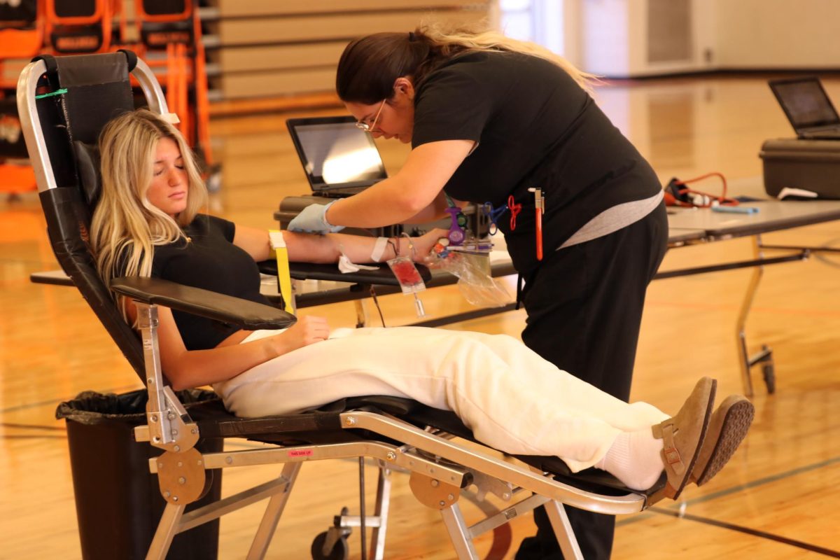 Getting her blood drawn, junior Blaze Hessling participates in the blood drive. On Nov. 10, FHS hosted the first blood drive of the year to help people in need of blood.