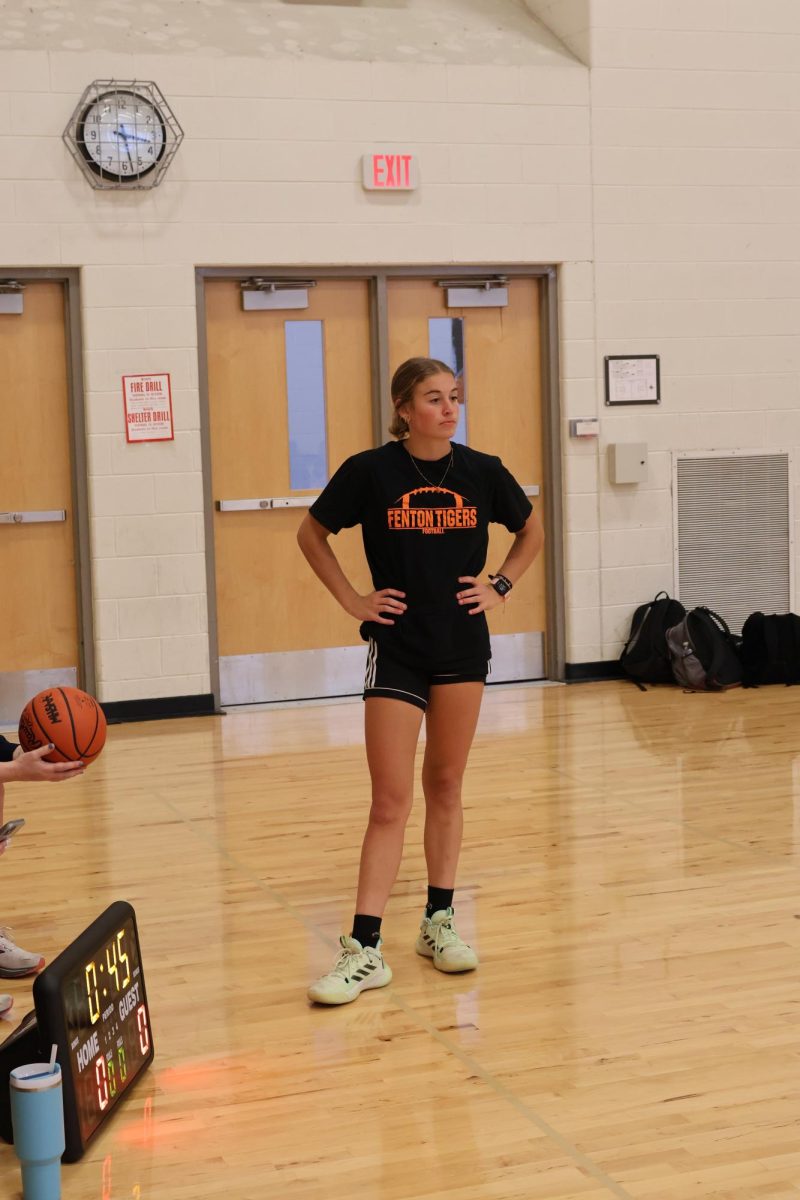 Listening to the coaches, junior Taryn Craven gets ready to start sprints. On Nov. 15, the girls basketball program held an after school conditioning in the Aux gym. 