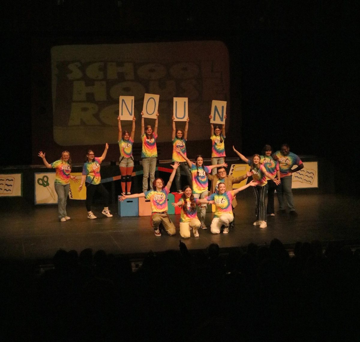 Posing, the choir performs A Noun Is a Person, Place or Thing. On Nov. 9-11, choir director, Brad Wright, directed his students in the School House Rock musical.  