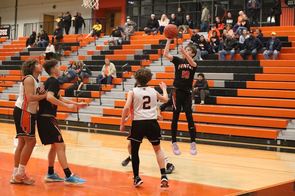 Shooting the ball, freshman Larkin Lafontaine scores a point for the tigers. On Dec. 7, the boys freshmen team played Flushing defeating them 59-42.