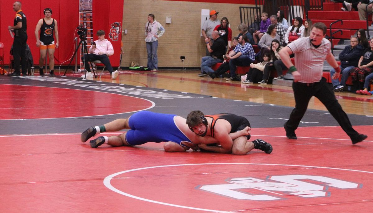 Wrestling, Seinor Philip lamka attempts to pin his opponent. On Dec. 14th the Fenton Tigers went up against Brandon and won 42 - 29