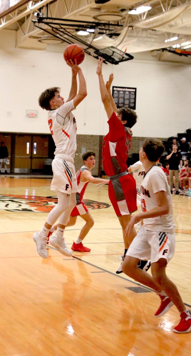 Putting up a shot freshmen Austin Sturgis scores. On Dec. 2, the fenton freshmen boys basketball team went up against Bedford winning 56-35.