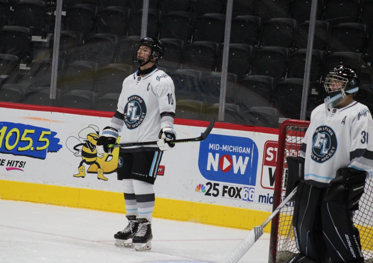 Waiting, Seniors Max Wright and Hank stand on the ice together. On Nov. 17, the Varsity Hockey team played Capitol City, but lost 1-4. 