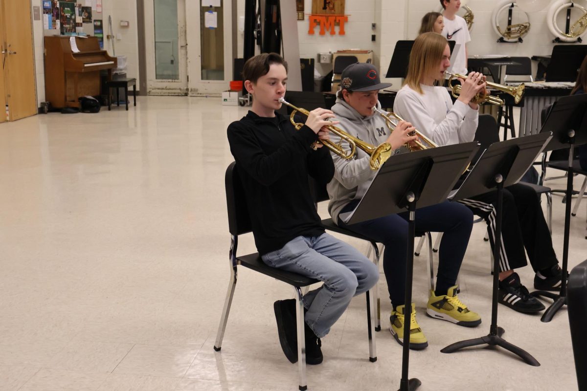 Practicing, Senior Tristan Bannerman plays trumpet. On Nov. 12, Wind Ensemble prepared for their upcoming winter concert. 