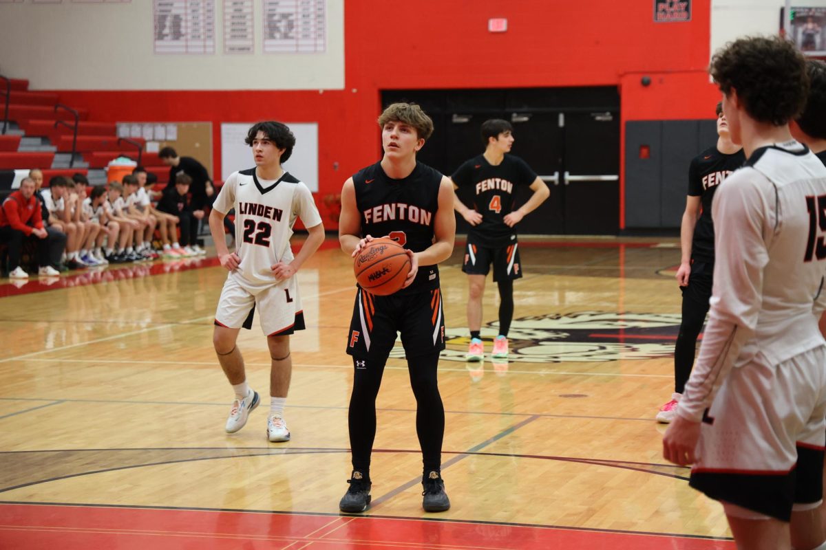 Preparing to shoot, sophomore Nathan Fuller gets ready to take his free throw. On Jan. 9, the boys JV basketball team played the Linden Eagles.