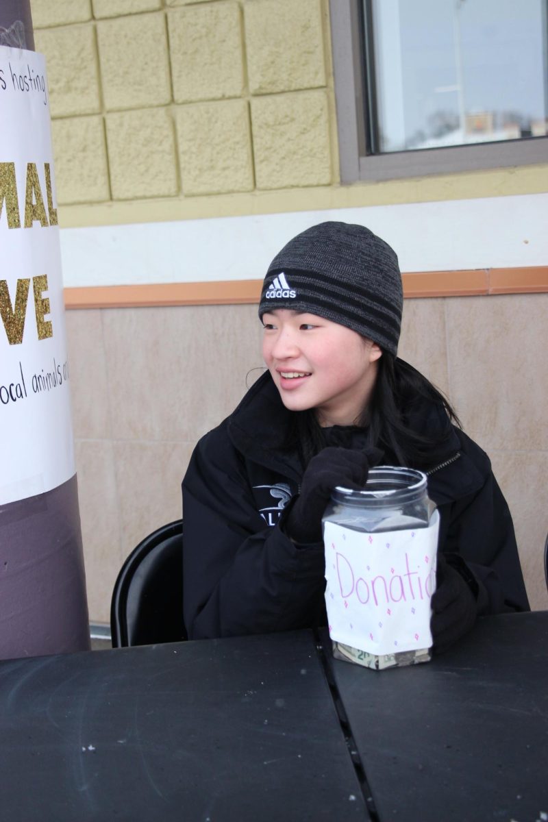 Collecting money, sophomore Alicia Verscheure volunteered. On Jan. 13, Fenton Youth Initiative hosted an animal drive for local shelters. 