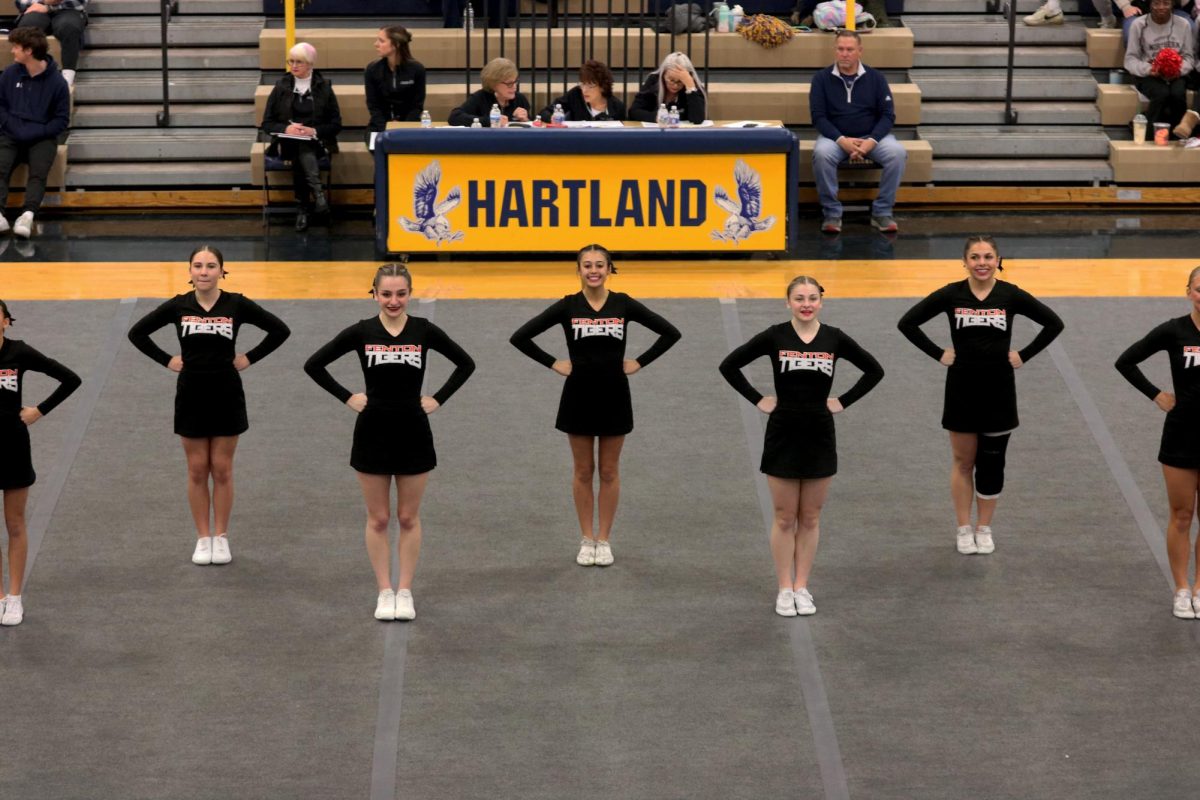 Getting+ready+for+round+two%2C+Fenton+Cheer+Team+smiles+at+the+crowd.+On+Jan.+20%2C+Fenton+Cheer+takes+first+place+at+the+Hartland+Heat+Invite.