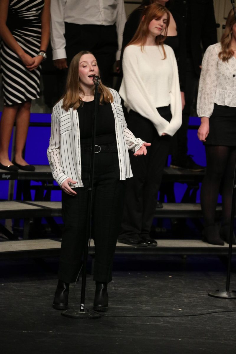 Performing a solo, senior Macy Wright performs for the crowd. On Dec. 12, the choir class performed a concert in the rubizima auditorium at Fenton high school.