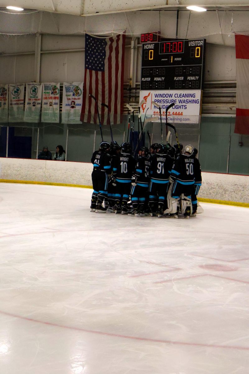 Huddling, the Fenton-Linden Area Hockey team gathers together before the game. On Dec. 16, Griffins lost to South Lyon United with a score of 3-6. 