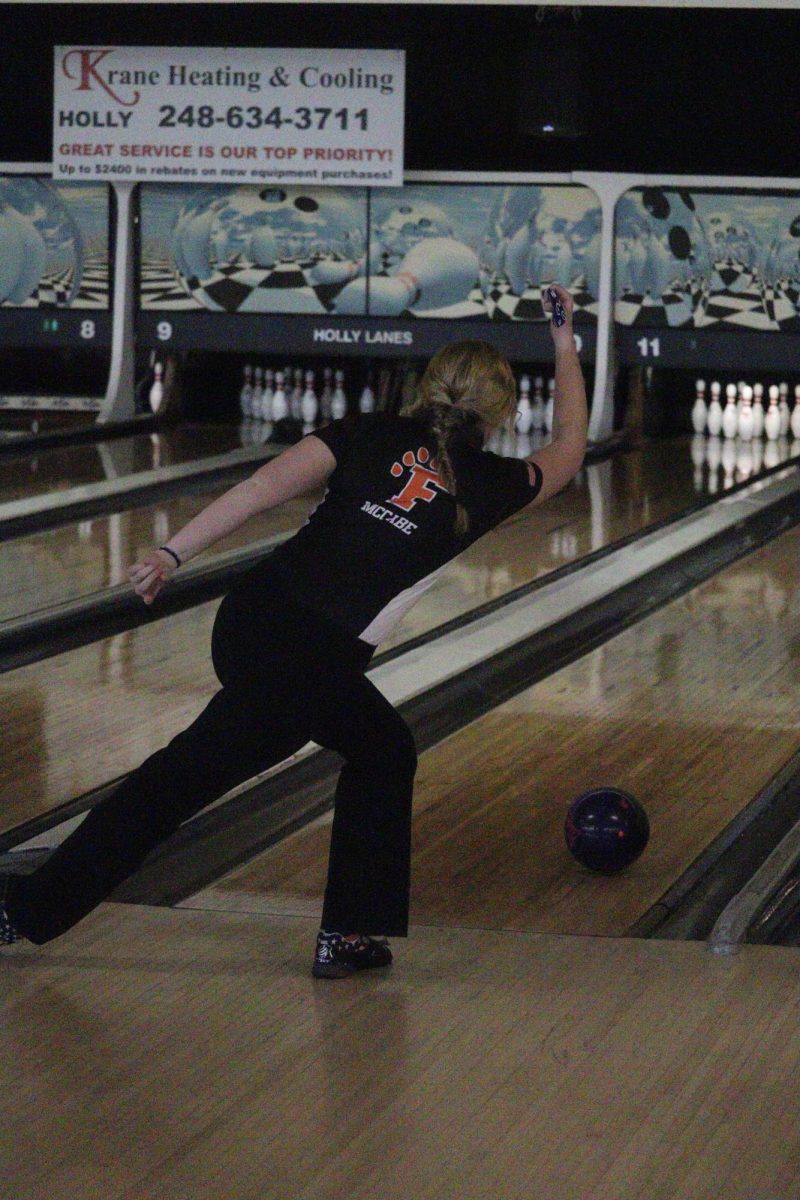 Rolling the ball, junior Addison McCabe bowls a strike. On Jan. 27, the Girls Varsity Bowling Team played against Goodrich.