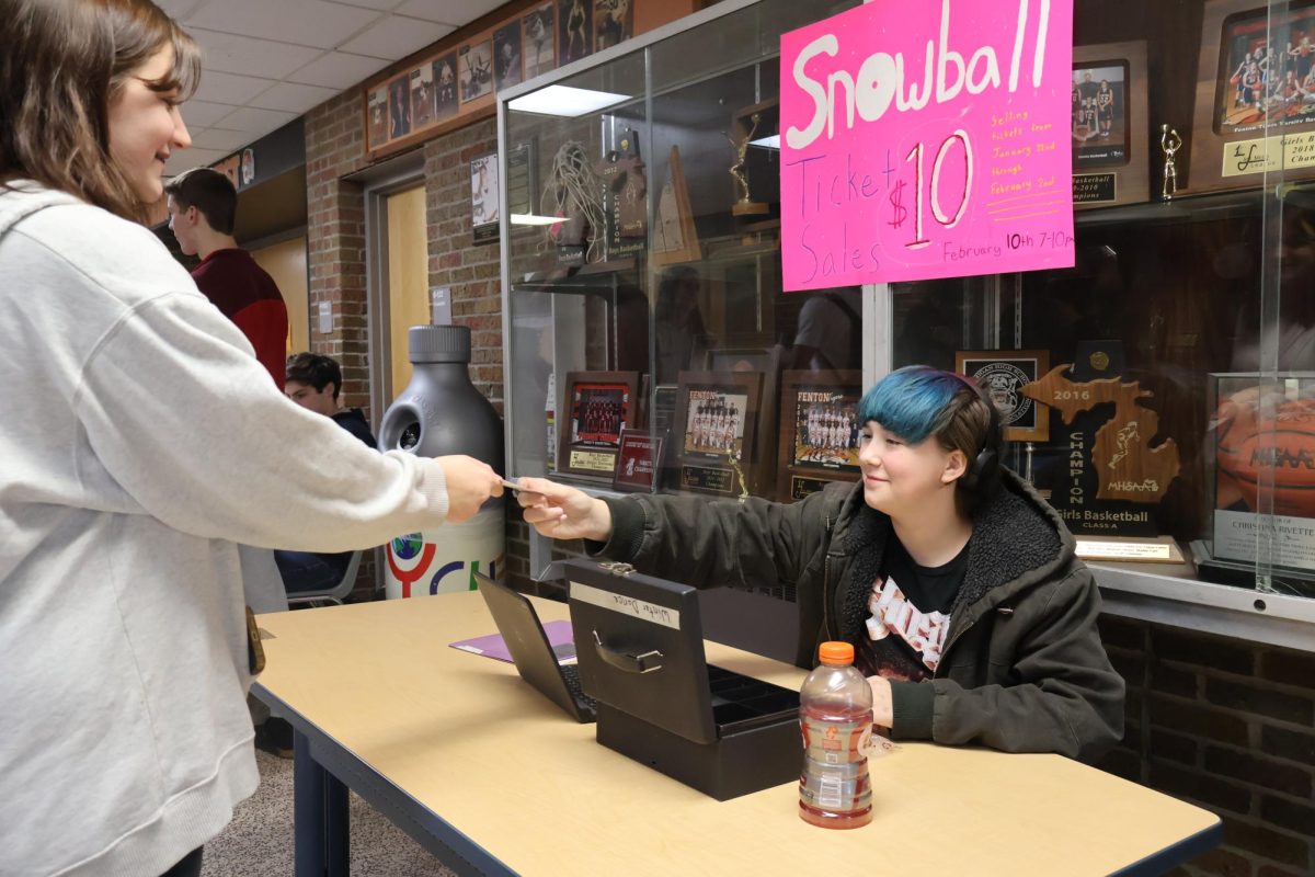 Selling tickets, student council raises money for the upcoming snowball. On Jan. 31st students purchase their ticket for the dance.