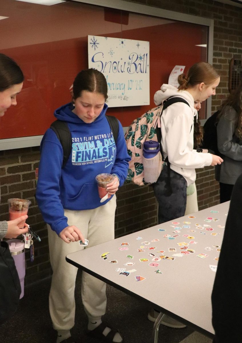 Wearing blue, junior Zoe Plunkett participates in color wars. During the week of Feb. 5, students dressed up for spirit days.