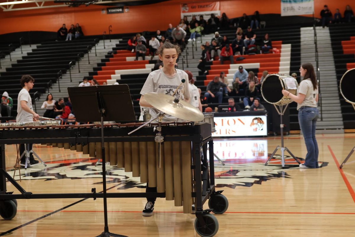 Focusing%2C+freshmen+Matthew+Casey+plays+the+xylophone.+On+Feb.+2%2C+the+FHS+winter+drumline+and+winterguard+performed+at+halftime+of+the+boys+varsity+basketball+game.+