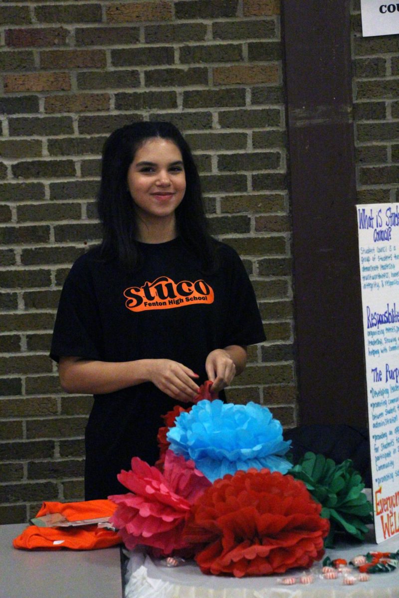Smiling, junior Sophia Kildee participates with Student Council. On Feb. 5, the 8th grade transition night took place. Clubs and classes set up stations for incoming freshmen to ask questions. 
